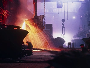 Sparks fly in a foundry during copper smelting Sparks fly in a foundry during copper smelting