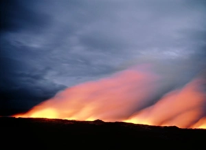 Steam rises as lava flows into the ocean in Hawaii Steam rises as lava flows into the ocean in Hawaii