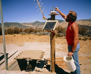 Technician checks earthquake equipment: Parkfield Technician checks earthquake equipment: Parkfield