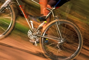 Time-exposure image of a cyclist riding a bicycle Time-exposure image of a cyclist riding a bicycle