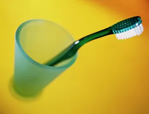 A toothbrush in a pot A toothbrush in a pot