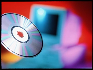 View of CD-ROM disc in front of personal computer View of CD-ROM disc in front of personal computer