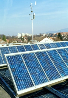 View of solar panels on the roof of a building View of solar panels on the roof of a building