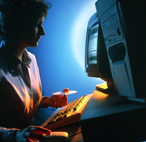 Woman using a personal computer (PC) at home Woman using a personal computer (PC) at home