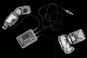 Prints of X-ray photography of digital camera and iPod music device Images Dated 2011 December: Digital Camera and iPod X-ray Print