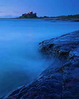 England, Northumberland, Bamburgh. Bamburgh Castle and the North Sea, viewed from Harkess Rocks England, Northumberland, Bamburgh. Bamburgh Castle and the North Sea, viewed from Harkess Rocks