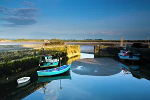 England, Northumberland, Beadnell. Boats moored within the Harbour Walls of the Beadnell Harbour - viewed at England, Northumberland, Beadnell. Boats moored within the Harbour Walls of the Beadnell Harbour - viewed at