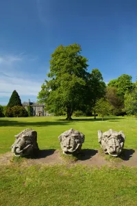 Northumberland Prints: Carved Stone Dragon Heads Print of Wallington Hall Gardens