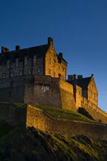 Images Dated 6th December 2008: Scotland, Edinburgh, Edinburgh Castle. The last light of the setting sun illuminates Edinburgh
