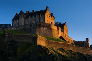 Scotland, Edinburgh, Edinburgh Castle. The last light of the setting sun illuminates Edinburgh Castle Scotland, Edinburgh, Edinburgh Castle. The last light of the setting sun illuminates Edinburgh Castle