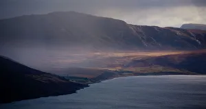 Scotland, Scottish Highlands, Little Loch Broom. Rain clears revealing the mountain peaks surrounding Little Scotland, Scottish Highlands, Little Loch Broom. Rain clears revealing the mountain peaks surrounding Little