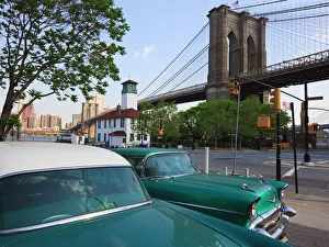 Two 1950s cars parked near the Brooklyn Bridge at Fulton Ferry Landing Two 1950s cars parked near the Brooklyn Bridge at Fulton Ferry Landing