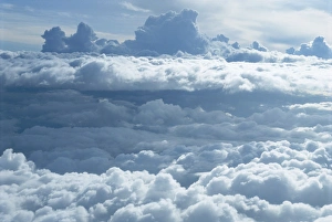 Aerial of banks of puffy white clouds seen from the air Aerial of banks of puffy white clouds seen from the air
