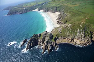 Aerial photo of Treen Cliff and Porthcurno beach looking west to the Minnack Theatre Aerial photo of Treen Cliff and Porthcurno beach looking west to the Minnack Theatre