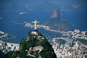 America Collection: Aerial view of city with the Cristo Redentor (Christ the Redeemer) statue in foreground