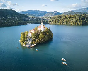 Aerial view by drone of Bled Island with the Church of the Assumption at dawn, Lake Bled Aerial view by drone of Bled Island with the Church of the Assumption at dawn, Lake Bled