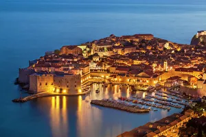 Aerial view of Old Port and Dubrovnik Old Town at night, UNESCO World Heritage Site Aerial view of Old Port and Dubrovnik Old Town at night, UNESCO World Heritage Site
