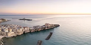 Aerial view of old town and lighthouse of Vieste at dawn, Foggia province Aerial view of old town and lighthouse of Vieste at dawn, Foggia province