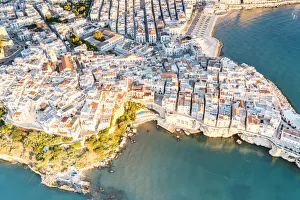 Aerial view of white buildings of Vieste by the crystal sea, Foggia province Aerial view of white buildings of Vieste by the crystal sea, Foggia province