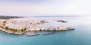 Aerial view of the white buildings of Vieste at sunrise, Foggia province Aerial view of the white buildings of Vieste at sunrise, Foggia province