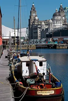 Albert Dock, with view of the Three Graces (riverfront buildings) behind Albert Dock, with view of the Three Graces (riverfront buildings) behind