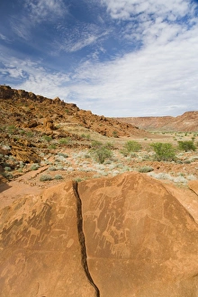 Ancient drawings (petroglyphs) on sandstone rock, dating back 6000 years to the early stone age Ancient drawings (petroglyphs) on sandstone rock, dating back 6000 years to the early stone age