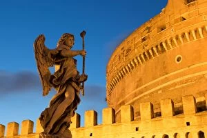 Angel Statue Collection: Angel statue on Ponte Sant Angelo bridge at dusk with Castel Sant Angelo, Rome, Lazio, Italy, Europe