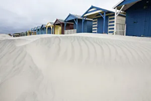 Beach huts in sand drift, West Wittering, West Sussex, England, United Kingdom, Europe Beach huts in sand drift, West Wittering, West Sussex, England, United Kingdom, Europe