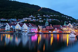 Bergens picturesque Bryggen District illuminated at dusk, UNESCO World Heritage Site, Bergen, Hordaland, Norway Bergens picturesque Bryggen District illuminated at dusk, UNESCO World Heritage Site, Bergen, Hordaland, Norway