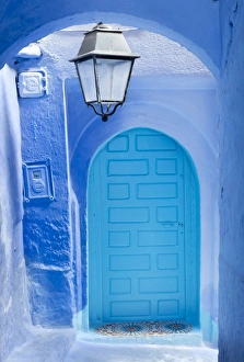 Blue door and wall in the old town of Chefchaouen (Chaouen) (The Blue City), Morocco Blue door and wall in the old town of Chefchaouen (Chaouen) (The Blue City), Morocco