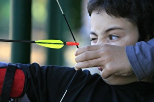 Boy doing archery, Forges-les-Eaux, Seine Maritime, France, Europe Boy doing archery, Forges-les-Eaux, Seine Maritime, France, Europe