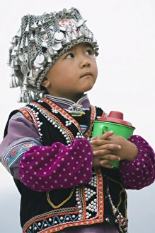 A boy dressed in Hani minority traditional clothing, Yuanyang, Yunnan Province A boy dressed in Hani minority traditional clothing, Yuanyang, Yunnan Province