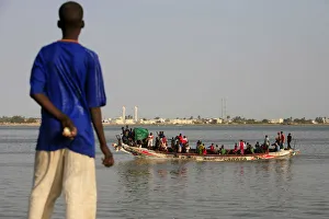 Boy looking at a boat, Saint Louis, Senegal, West Africa, Africa Boy looking at a boat, Saint Louis, Senegal, West Africa, Africa
