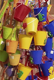 Fifteen brightly coloured buckets, mainly yellow and blue, for sale, Skegness Fifteen brightly coloured buckets, mainly yellow and blue, for sale, Skegness