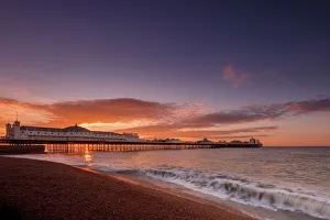 Brighton Pier and beach at sunrise, Brighton, East Sussex, Sussex, England, United Kingdom Brighton Pier and beach at sunrise, Brighton, East Sussex, Sussex, England, United Kingdom