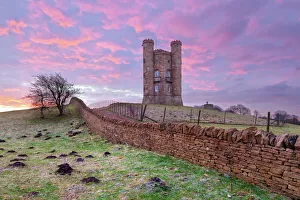 Broadway Tower and Cotswold drystone wall at sunrise, Broadway, Cotswolds, Worcestershire Broadway Tower and Cotswold drystone wall at sunrise, Broadway, Cotswolds, Worcestershire