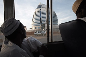 A bus passes the 5-star Boji Al-Fateh Hotel (Libyan Hotel) A bus passes the 5-star Boji Al-Fateh Hotel (Libyan Hotel)