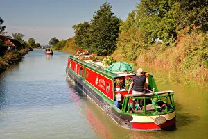 Canal boats idling their way down the Kennet and Avon Canal, Wiltshire, England Canal boats idling their way down the Kennet and Avon Canal, Wiltshire, England