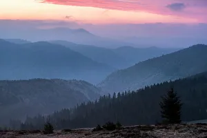 Carpathian Mountains landscape during a misty sunrise, Ranca, Oltenia Region, Romania Carpathian Mountains landscape during a misty sunrise, Ranca, Oltenia Region, Romania