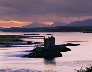 Castle Stalker on Loch Linnhe, silhouetted at dusk, Argyll, Scotland, United Kingdom Castle Stalker on Loch Linnhe, silhouetted at dusk, Argyll, Scotland, United Kingdom