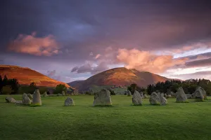 Castlerigg Stone Circle in autumn at sunrise with Blencathra bathed in dramatic dawn light Castlerigg Stone Circle in autumn at sunrise with Blencathra bathed in dramatic dawn light