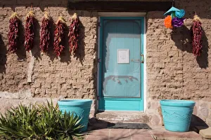 Chili peppers on adobe wall, Tubac, Greater Tucson Region, Arizona, United States of America Chili peppers on adobe wall, Tubac, Greater Tucson Region, Arizona, United States of America
