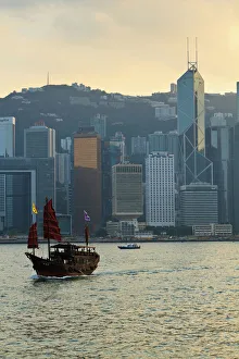 Chinese sailing junk on Victoria Harbour, the skyline of Central, Hong Kong Island beyond Chinese sailing junk on Victoria Harbour, the skyline of Central, Hong Kong Island beyond