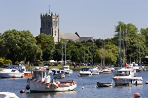 Christchurch Priory and pleasure boats on the River Stour, Dorset, England Christchurch Priory and pleasure boats on the River Stour, Dorset, England