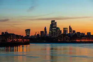 UK Landmarks Prints: The City of London skyline at sunset reflecting in River Thames