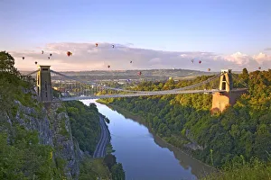 Clifton Suspension Bridge with hot air balloons in the Bristol Balloon Fiesta in August Clifton Suspension Bridge with hot air balloons in the Bristol Balloon Fiesta in August