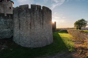 Historic Fortress Architecture Prints: Close up of the corner wall tower with sun rays behind it