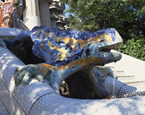 Close-up of a mosaic dragon statue in the Guell Park of Gaudi architecture Close-up of a mosaic dragon statue in the Guell Park of Gaudi architecture