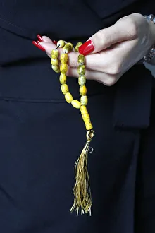 Close-up of Muslim woman holding Islamic prayer beads, Vietnam, Indochina, Southeast Asia Close-up of Muslim woman holding Islamic prayer beads, Vietnam, Indochina, Southeast Asia