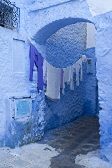 Clothes drying in a typical house entrance, Chefchaouen, Morocco, North Africa, Africa Clothes drying in a typical house entrance, Chefchaouen, Morocco, North Africa, Africa